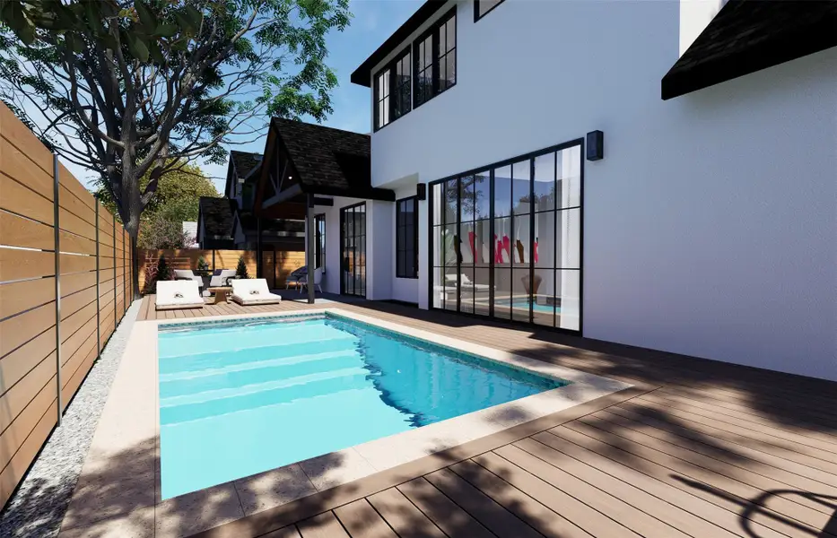 An inviting backyard swimming pool is bordered by clean decking and a wooden privacy fence. An inviting backyard swimming pool is bordered by clean decking and a wooden privacy fence.
