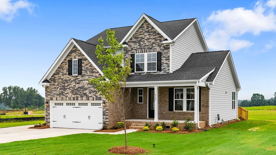 Front exterior of a new home in Lilah Grove, Summerfield, NC, highlighting curb appeal (Image 2).