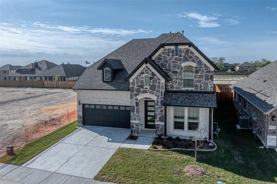 Front exterior of a new home in Meadow Vista, Anna, TX, highlighting curb appeal (Image 25).