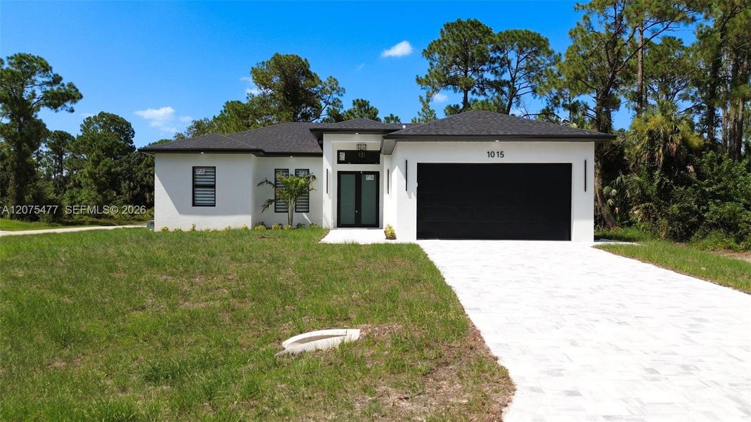 Front exterior of a new home in , Lehigh Acres, FL, highlighting curb appeal (Image 1). Front exterior of a new home in , Lehigh Acres, FL, highlighting curb appeal (Image 1).
