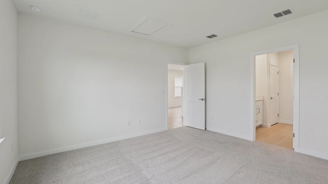 Naples First Floor Primary Suite with en suite bath with large walk-in closet at Grasslands West in Lakeland FL