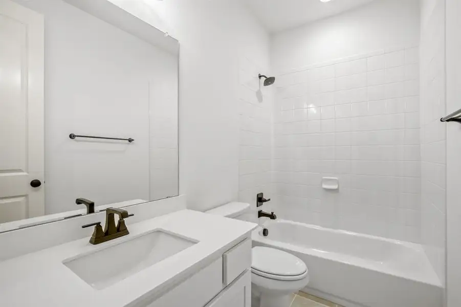 Full bathroom with vanity, shower / tub combination, and recessed lighting