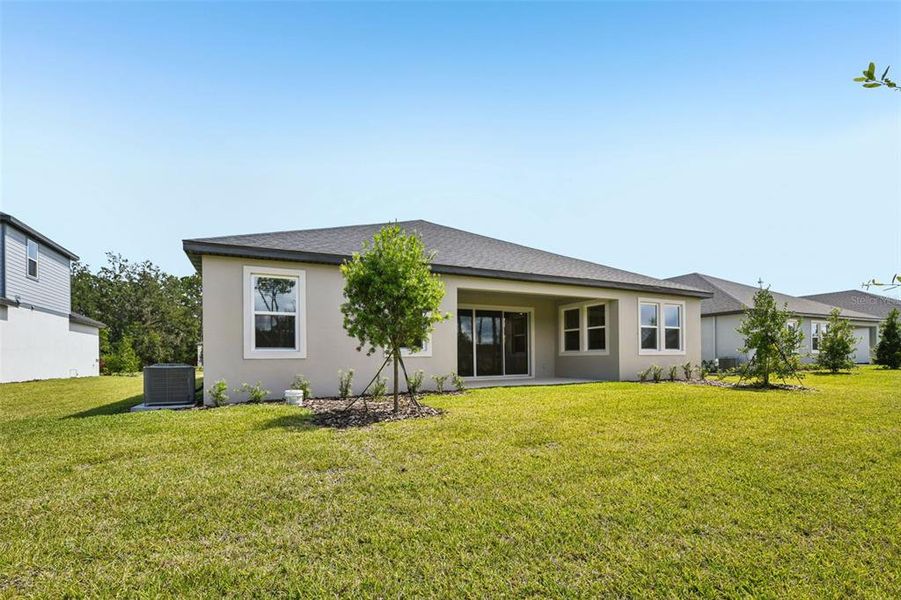 Exterior details and patio area of a home in Ridgehaven - Reserve Series, Ormond Beach (Image 23).