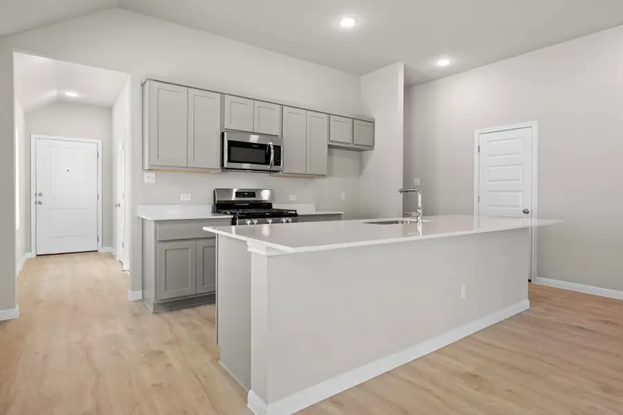 Kitchen in the Spruce home plan by Trophy Signature Homes - REPRESENTATIVE PHOTO Kitchen in the Spruce home plan by Trophy Signature Homes - REPRESENTATIVE PHOTO