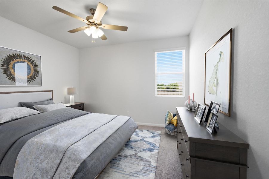 Bedroom featuring carpet and ceiling fan