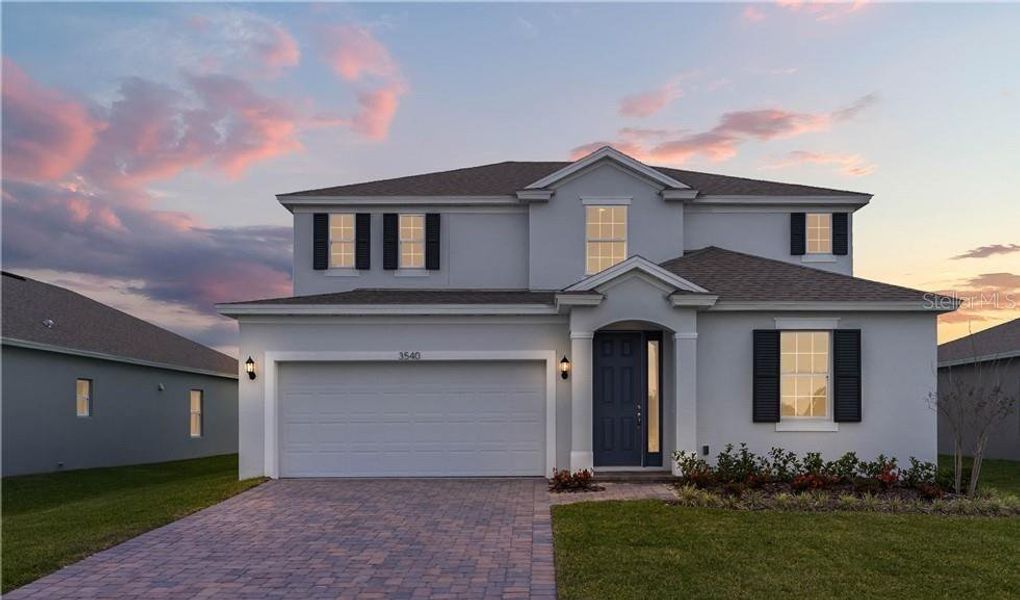 Front exterior of a new home in Willowbrook North, Winter Haven, FL, highlighting curb appeal (Image 1).