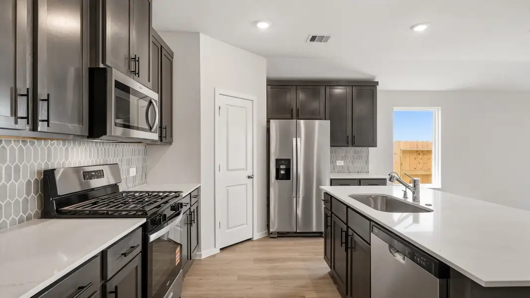 Furnished interior view inside a new home in Sunterra Lakes, Brookshire (Image 6).