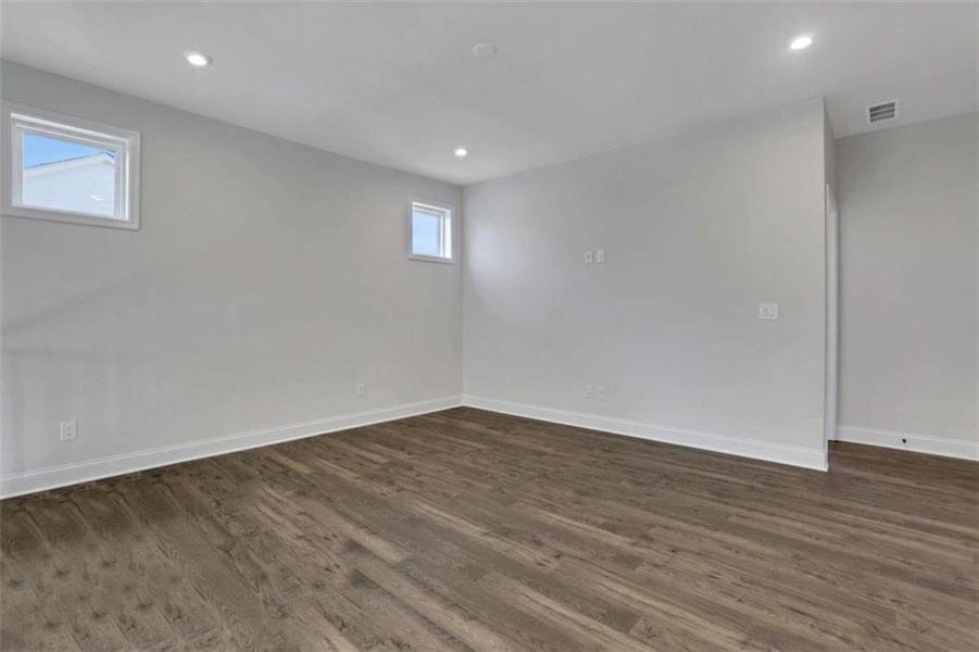 Spacious, unfurnished interior of a new home in The Paddocks at Doc Hughes, Buford (Image 53).