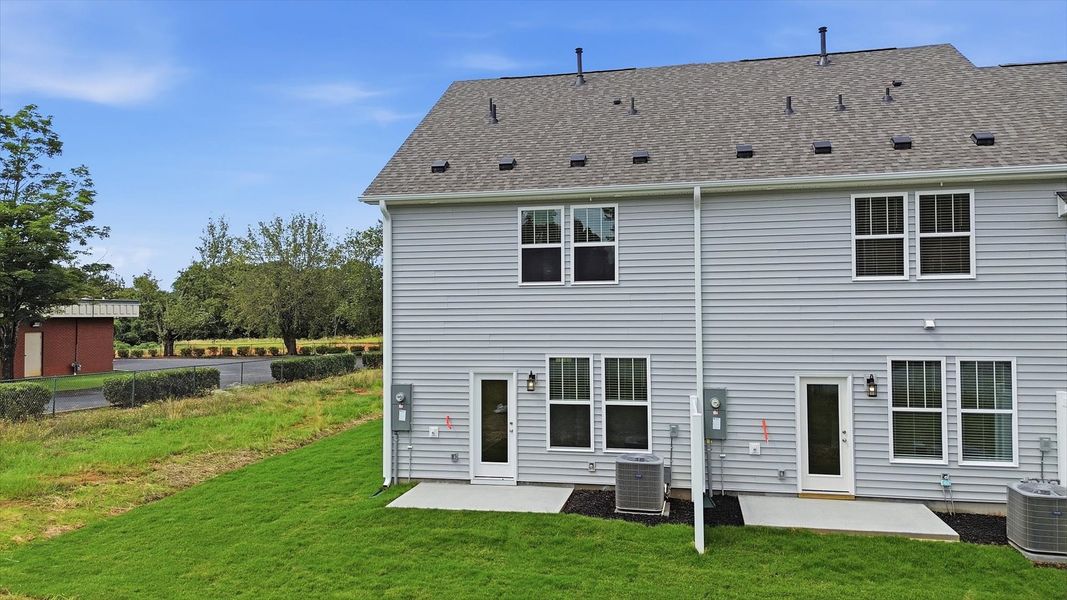 Accomplished exterior with a spacious backyard that blends comfort and style at Clarke Townes