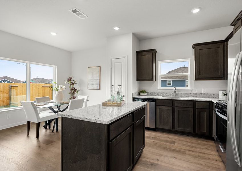 The dining room sits right off of the kitchen. The dining room sits right off of the kitchen.