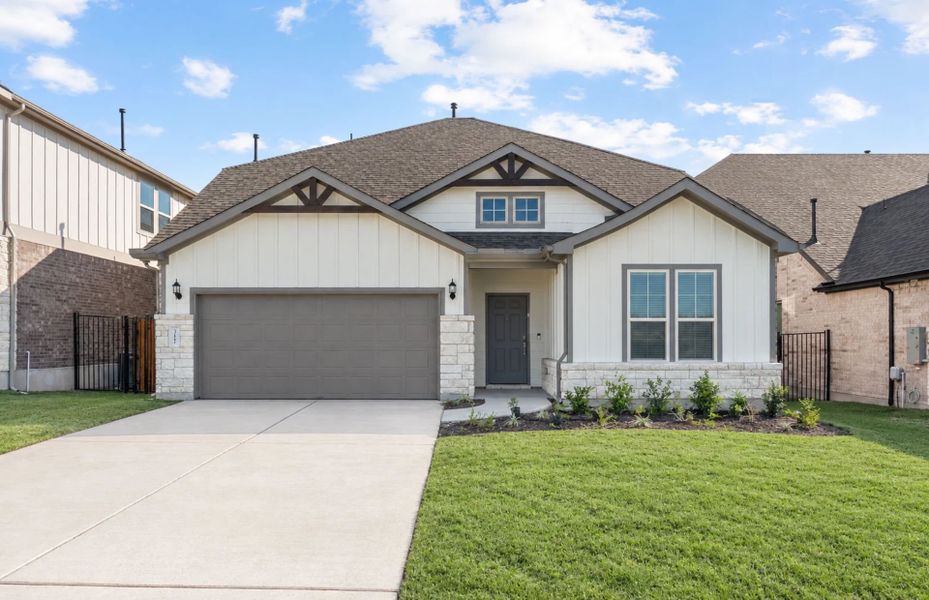Front exterior of a new home in Saddleback at Santa Rita Ranch, Liberty Hill, TX, highlighting curb appeal (Image 25). Front exterior of a new home in Saddleback at Santa Rita Ranch, Liberty Hill, TX, highlighting curb appeal (Image 25).
