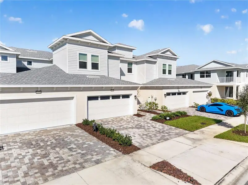 Front exterior of a new home in , Wesley Chapel, FL, highlighting curb appeal (Image 2).