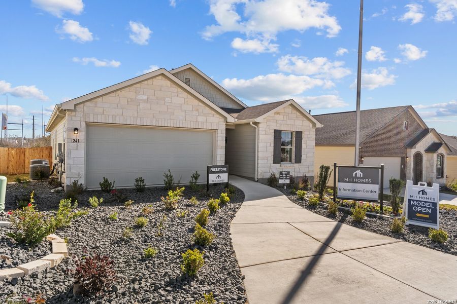 Front exterior of a new home in Hunters Ranch, San Antonio, TX, highlighting curb appeal (Image 24).