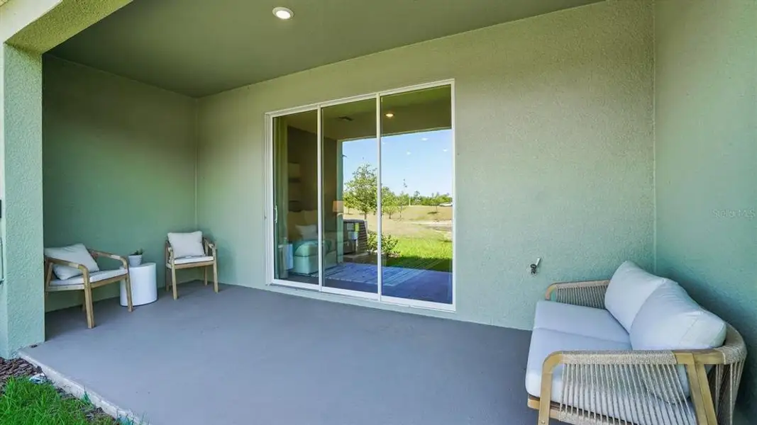 Exterior details and patio area of a home in Sanctuary at Citrus Park Townhomes, Tampa (Image 3).