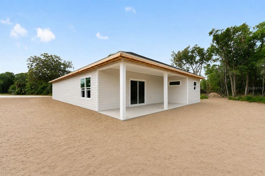 Exterior details and patio area of a home in , Williston (Image 3).