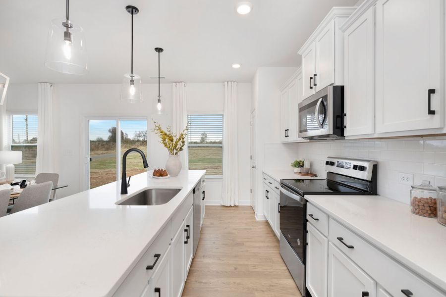 Representative furnished interior of a home built from the TA1800 by True Homes in Streamside, Red Cross (Image 5).