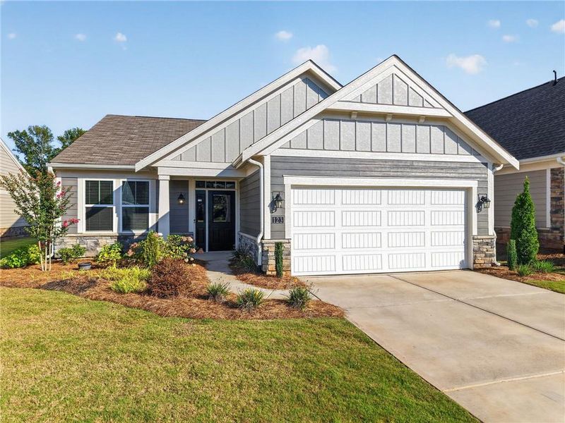 Front exterior of a new home in Laurel Farms, Dallas, GA, highlighting curb appeal (Image 18).
