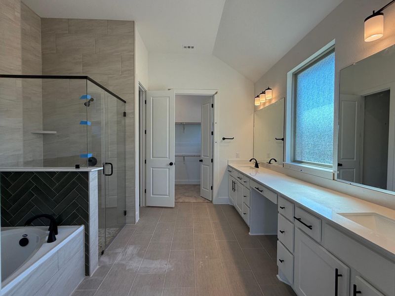 Primary Bath retreat with dual vanities, garden tub & walk-in shower Primary Bath retreat with dual vanities, garden tub & walk-in shower