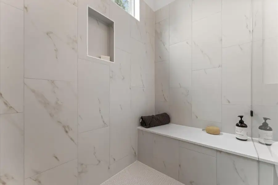 Elegant and serene primary bathroom designed to offer both style and functionality. The space features a luxurious soaking tub ideal for unwinding, a separate glass-enclosed shower for quick refreshes, and a sleek double vanity with ample countertop space and storage—perfect for busy mornings or relaxing evenings. Elegant and serene primary bathroom designed to offer both style and functionality. The space features a luxurious soaking tub ideal for unwinding, a separate glass-enclosed shower for quick refreshes, and a sleek double vanity with ample countertop space and storage—perfect for busy mornings or relaxing evenings.