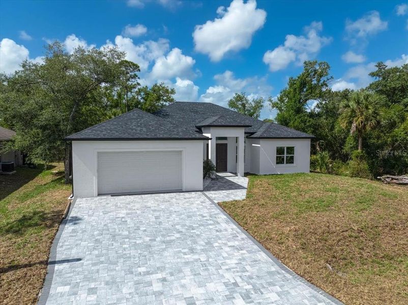 Front exterior of a new home in , North Port, FL, highlighting curb appeal (Image 25).