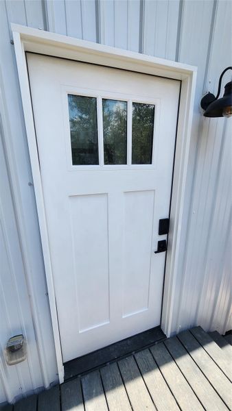 Entrance to property with metal siding. Entrance to property with metal siding.
