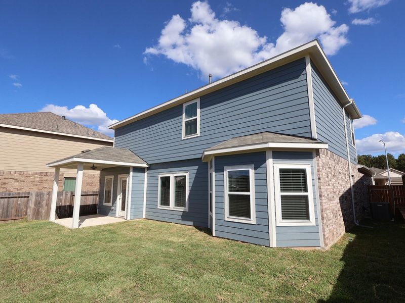 Exterior details and patio area of a home in Magnolia Ridge, Magnolia (Image 3). Exterior details and patio area of a home in Magnolia Ridge, Magnolia (Image 3).