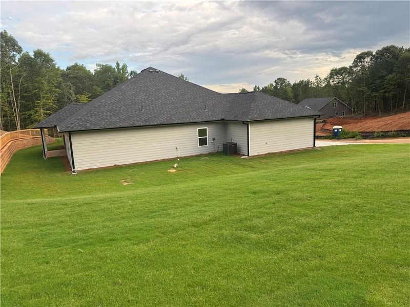 Exterior details and patio area of a home in The Fields of Walnut Creek, Pendergrass (Image 4).