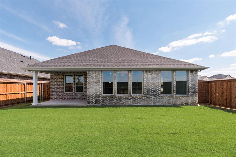Exterior details and patio area of a home in Spiritas Ranch, Little Elm (Image 3). Exterior details and patio area of a home in Spiritas Ranch, Little Elm (Image 3).