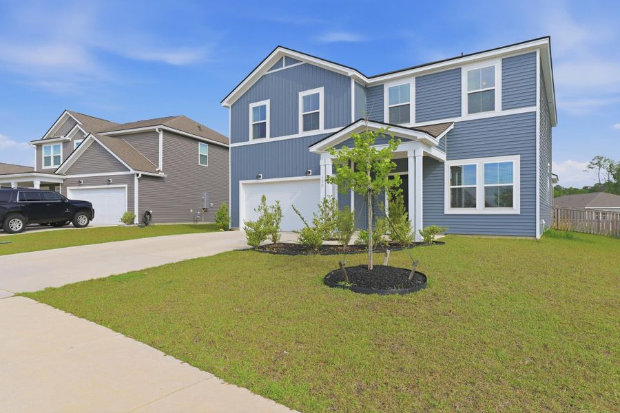 Front exterior of a new home in Bradford Pointe, Summerville, SC, highlighting curb appeal (Image 22).
