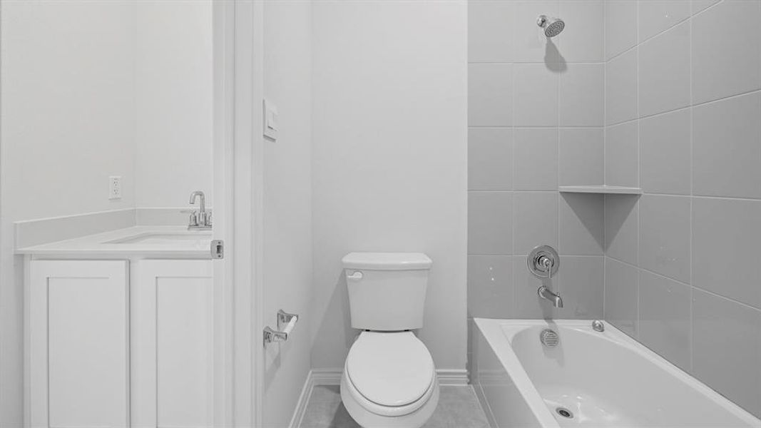 Bathroom featuring vanity and washtub / shower combination Bathroom featuring vanity and washtub / shower combination