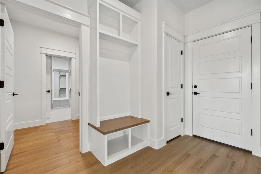 Mudroom featuring wood-type flooring