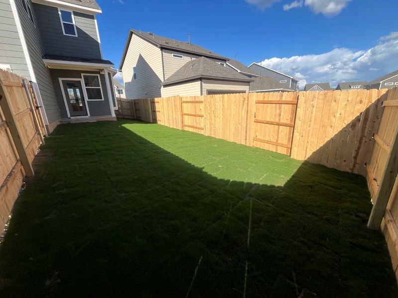 Exterior details and patio area of a home in Lariat, Liberty Hill (Image 17).