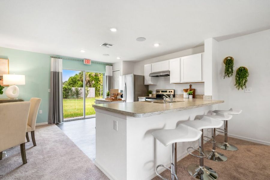 Representative furnished interior of a home built from the Bamboo by Holiday Builders in Port St Lucie, Port St. Lucie (Image 8).