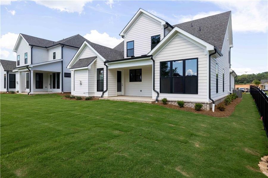 Exterior details and patio area of a home in Promenade at Sawnee Village, Cumming (Image 25).