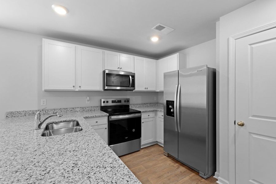 Furnished interior view inside a new home in Pine Hills at Cane Bay, Summerville (Image 4). Furnished interior view inside a new home in Pine Hills at Cane Bay, Summerville (Image 4).