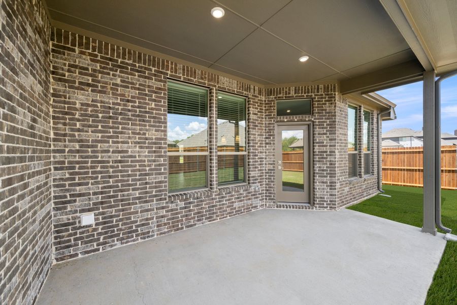 Exterior details and patio area of a home in Mockingbird Hills - Signature Series, Joshua (Image 3).