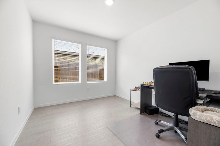 Home office boasts double doors for privacy.