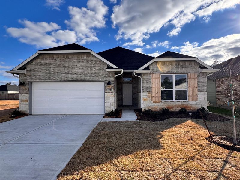 Front exterior of a new home in Grand Oaks Reserve, Cleveland, TX, highlighting curb appeal (Image 2). Front exterior of a new home in Grand Oaks Reserve, Cleveland, TX, highlighting curb appeal (Image 2).