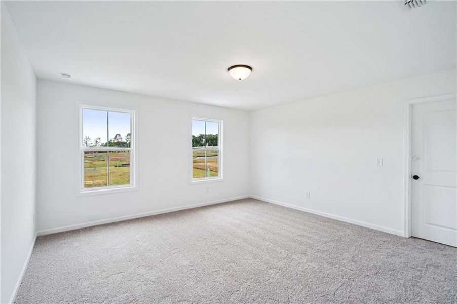 Spacious, unfurnished interior of a new home in Eastlyn Crossing, Flowery Branch (Image 23).