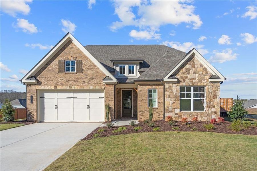 Front exterior of a new home in Yellowstone Farms, Cumming, GA, highlighting curb appeal (Image 2).