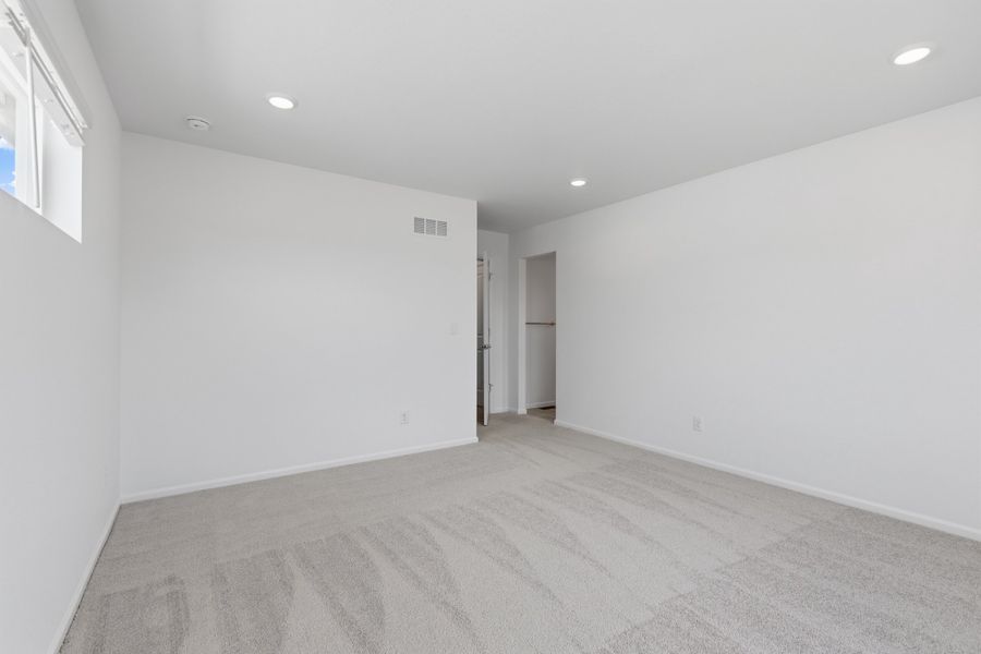 Spacious, unfurnished interior of a new home in Woodrose at Painted Prairie, Aurora (Image 15).