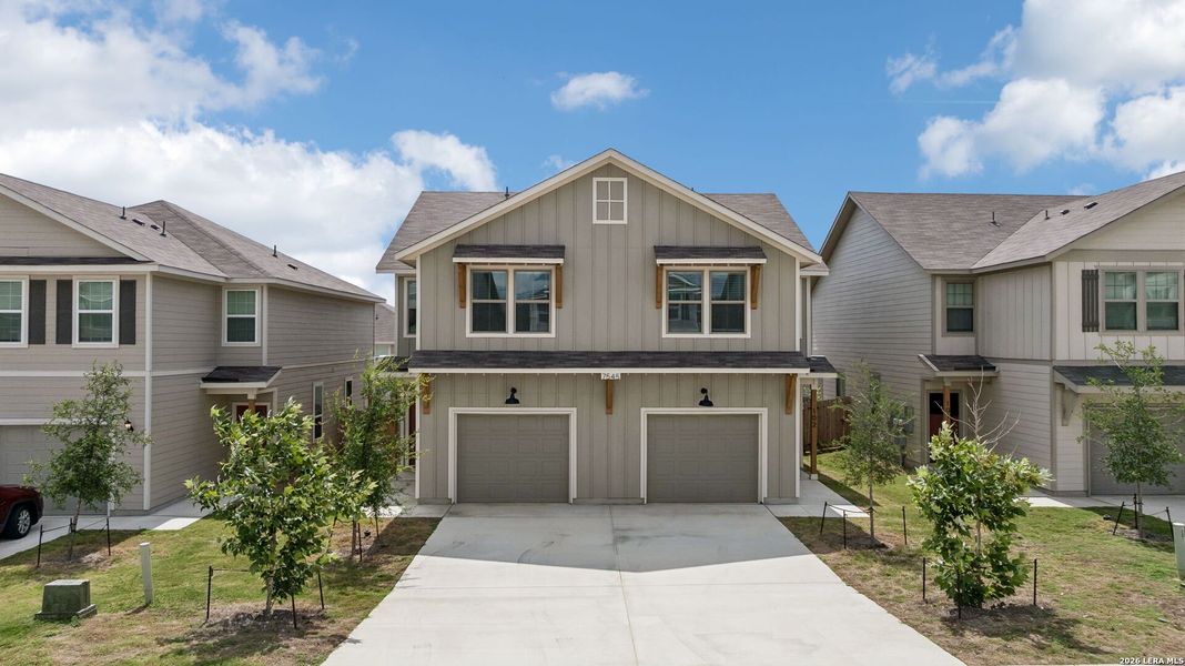 Front exterior of a new home in Magnolia Village North, San Antonio, TX, highlighting curb appeal (Image 22).