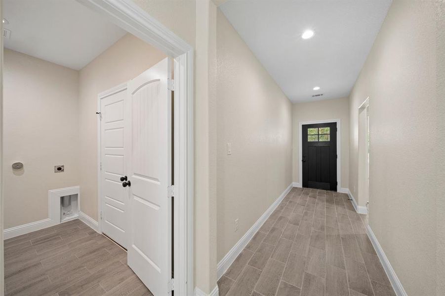 Corridor featuring wood-type flooring