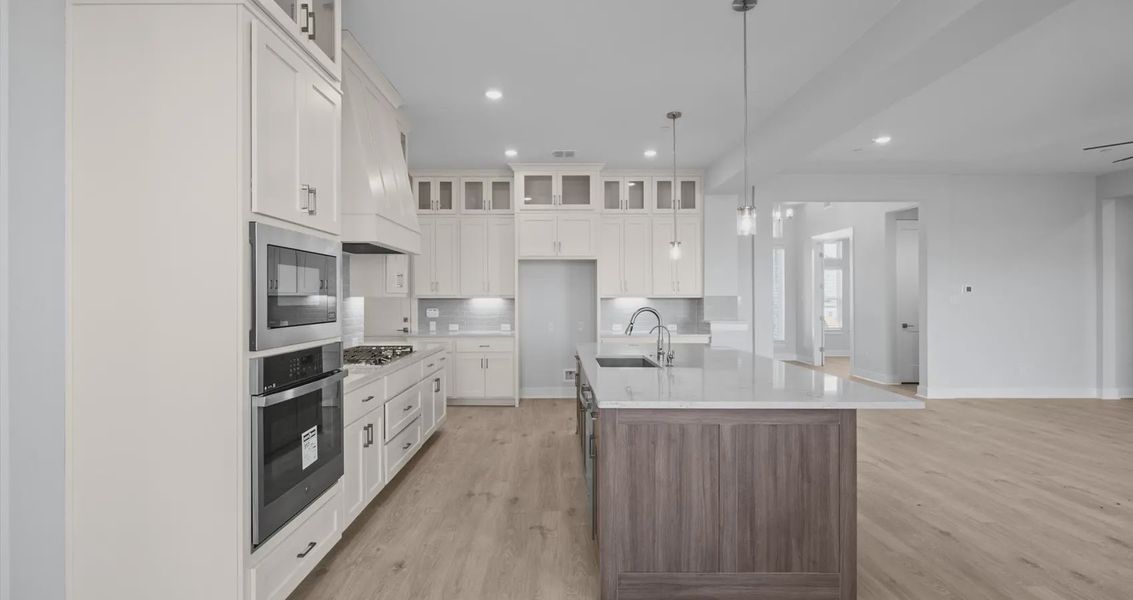 Representative furnished interior of a home built from the Raegan by Chesmar Homes in Sweetwater, Austin (Image 5).