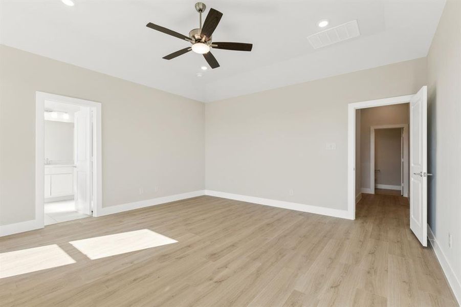 Unfurnished living room with light wood-type flooring, a ceiling fan, and recessed lighting Unfurnished living room with light wood-type flooring, a ceiling fan, and recessed lighting