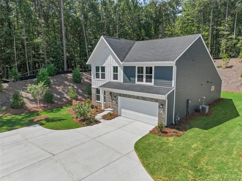 Front exterior of a new home in Easton Park, Dallas, GA, highlighting curb appeal (Image 21). Front exterior of a new home in Easton Park, Dallas, GA, highlighting curb appeal (Image 21).