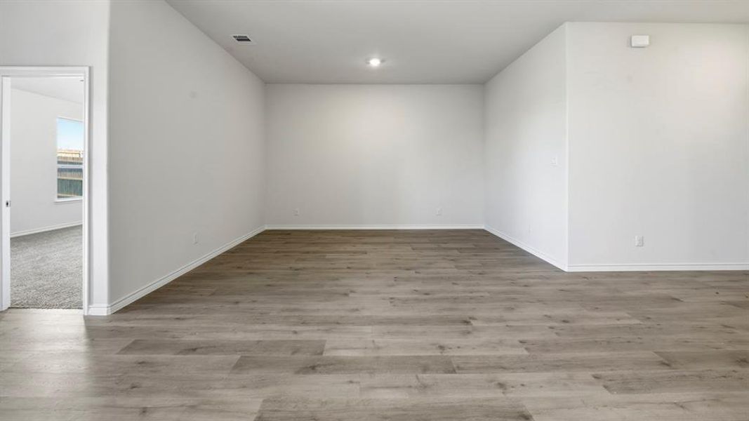 Spare room featuring light wood-style flooring Spare room featuring light wood-style flooring