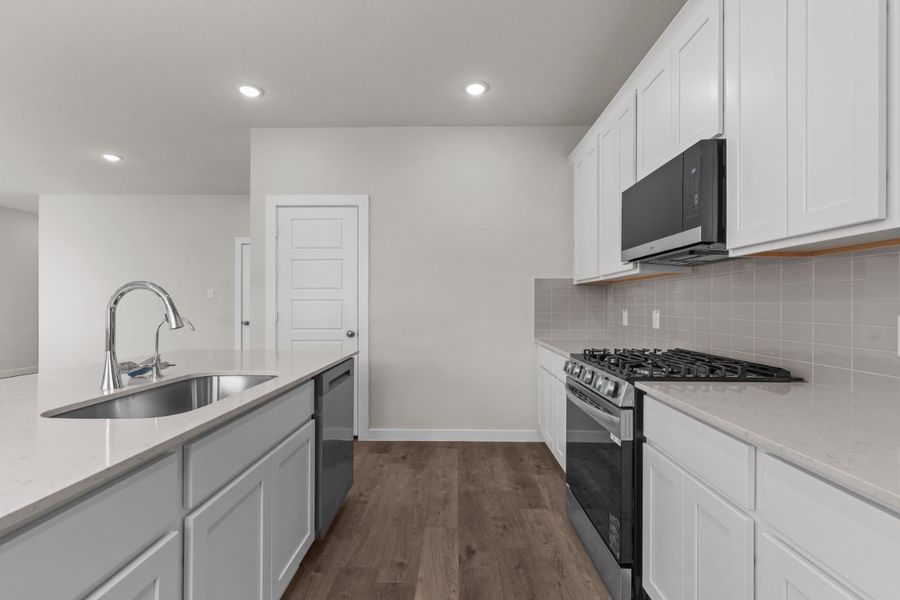 A kitchen with white cabinets. A kitchen with white cabinets.