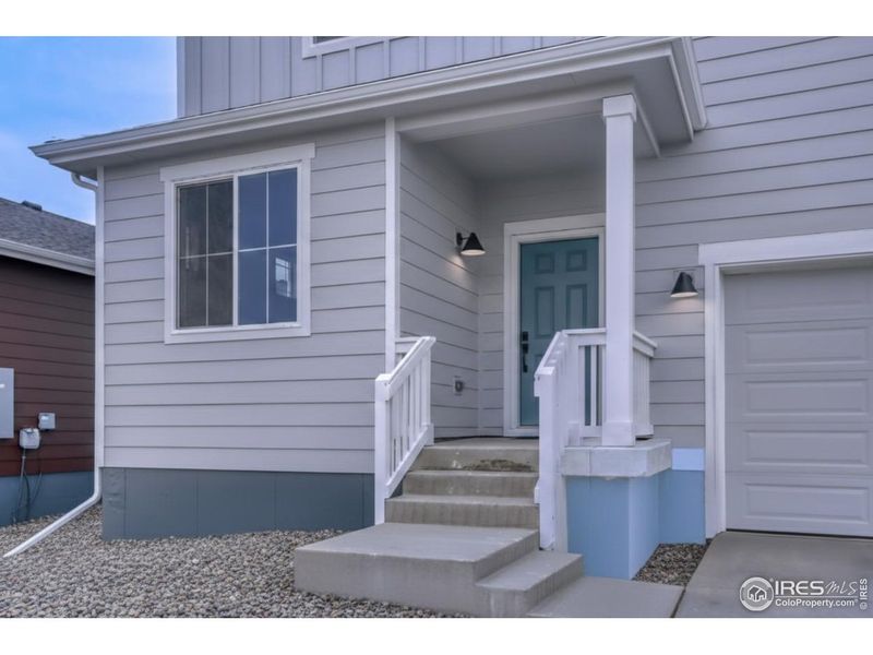 Exterior details and patio area of a home in Farmstead, Berthoud (Image 3).