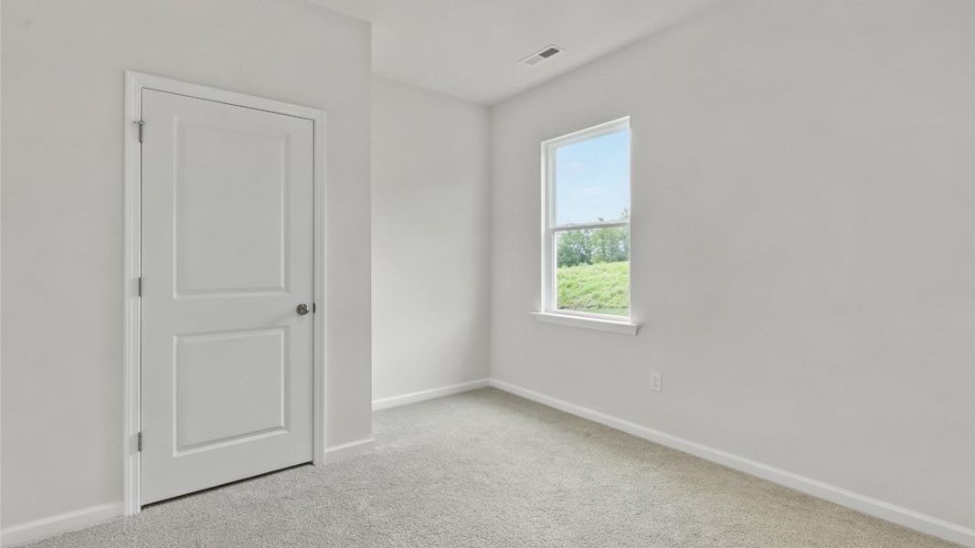 Representative unfurnished interior of a home built from the Robie by D.R. Horton in The Grove at Matthews Landing, Fuquay Varina (Image 16).
